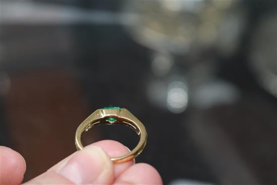 An 18k and solitaire emerald ring, size O/P.